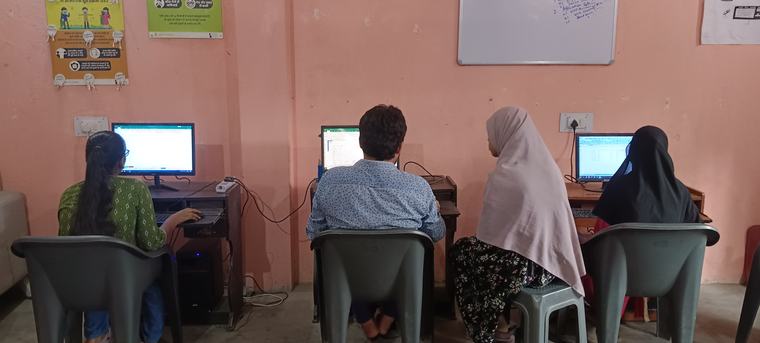 Learners practising at computer stations