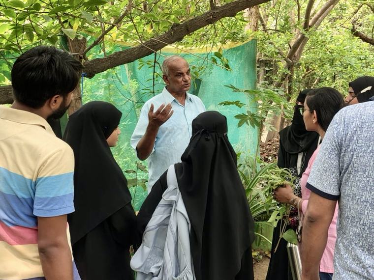 Fellows listening to a local expert on a field visit