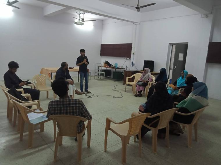 Fellows in a circle discussion
