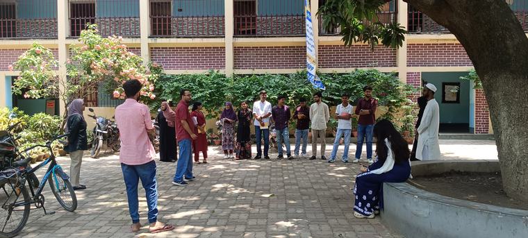 Fellows gathered in a courtyard