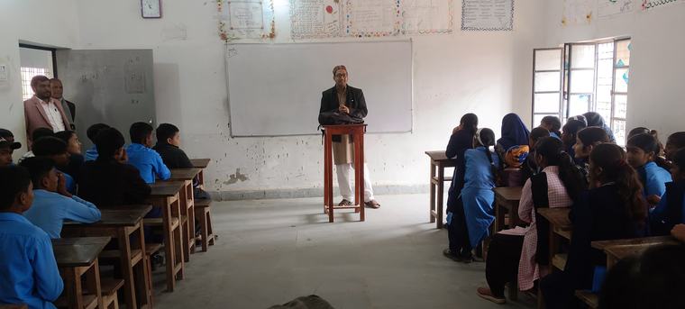 Speaking with students during a school visit
