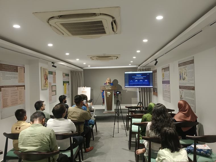 A speaker addressing the Dialogue at Planet Patna